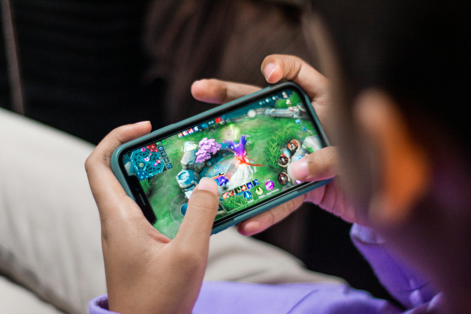 http://a%20person%20is%20playing%20a%20video%20game%20on%20their%20phone