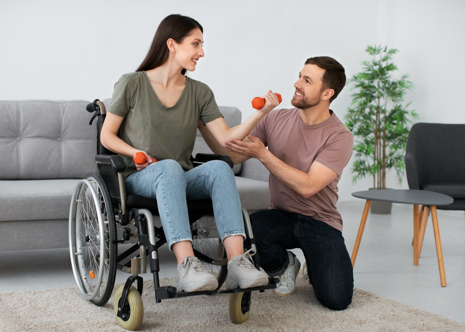 http://A%20man%20in%20a%20wheel%20chair%20being%20pushed%20by%20a%20woman